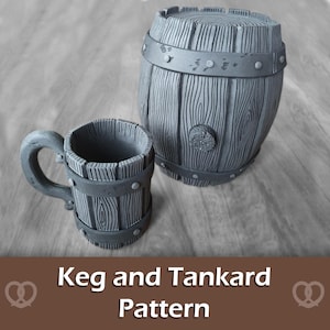 May include: A gray, wooden-textured keg and tankard set. The keg is barrel-shaped with metal bands and a spigot. The tankard has a handle and matching metal bands. The text "Keg and Tankard Pattern" is displayed at the bottom of the image.
