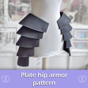 May include: A set of black hip armor plates displayed on a white mannequin torso. The armor consists of four overlapping, layered segments on each side, featuring a smooth, matte finish and a structured, geometric design for the hip area.