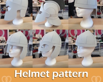 May include: A collection of gray helmet patterns displayed on mannequin heads. The helmets vary in design, including a gladiator style with a black crest and a simple medieval style. The text "Helmet pattern Collection" is displayed on an orange background.