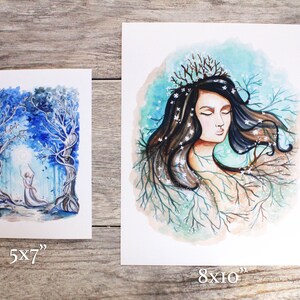 May include: Two watercolor paintings on white paper. The first painting is 5x7 inches and depicts a figure in a white dress standing in a blue and white forest. The second painting is 8x10 inches and depicts a woman with long brown hair and a crown of branches, surrounded by blue and white branches.