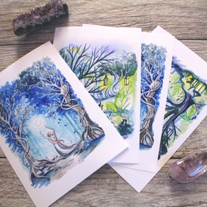 May include: Four watercolor paintings on white paper, each depicting a whimsical forest scene with trees, foliage, and a moon. The paintings are arranged in a fan shape, with the top painting showing a figure reaching up to the moon.