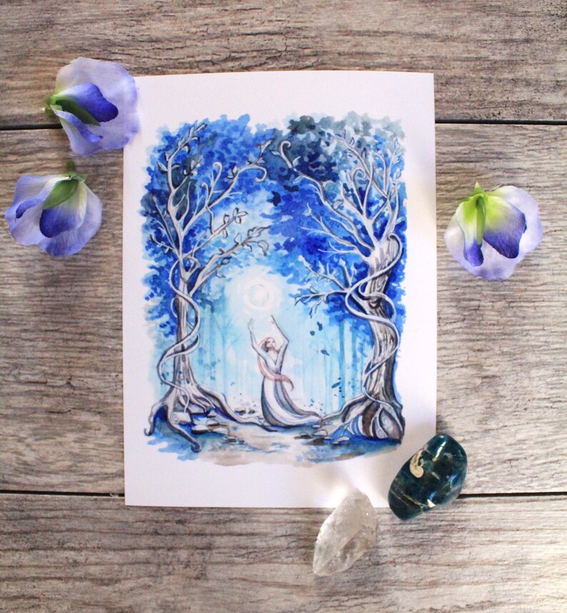 May include: Watercolor painting of a woman in a white dress with blue accents, standing in a blue forest with her arms raised towards the moon. The trees are intertwined and the background is a soft blue.