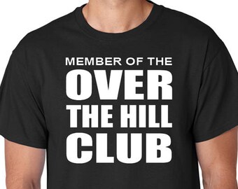 May include: Black t-shirt with white text that reads "Member of the Over the Hill Club".