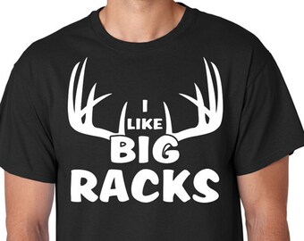 May include: Black t-shirt with a white graphic of a deer antler with the text "I like big racks".