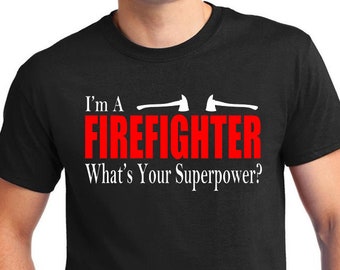 May include: Black t-shirt with white text that reads "I'm a Firefighter What's Your Superpower?" with two white axe graphics above the word "Firefighter".