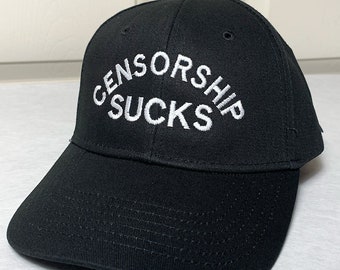 May include: Black baseball cap with white embroidered text that reads "Censorship Sucks".