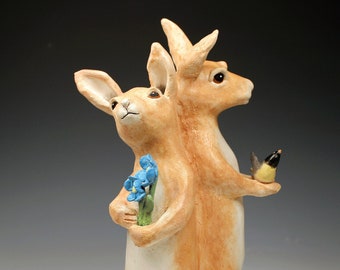 2 ceramic gift bearing hares