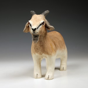 Ceramic tan and white goat sculpture