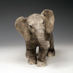 Ceramic baby elephant sculpture