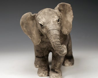 Ceramic baby elephant sculpture