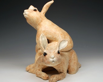 2 playful hares, delightful and anthropomorphic ceramic hare sculpture