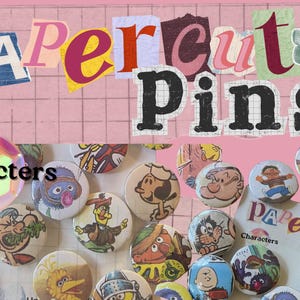 May include: A collection of 1.25-inch character pins with a pink background. The pins feature various cartoon characters. The words "Papercut Pins" are displayed in a collage style. The word "Characters" is also displayed.