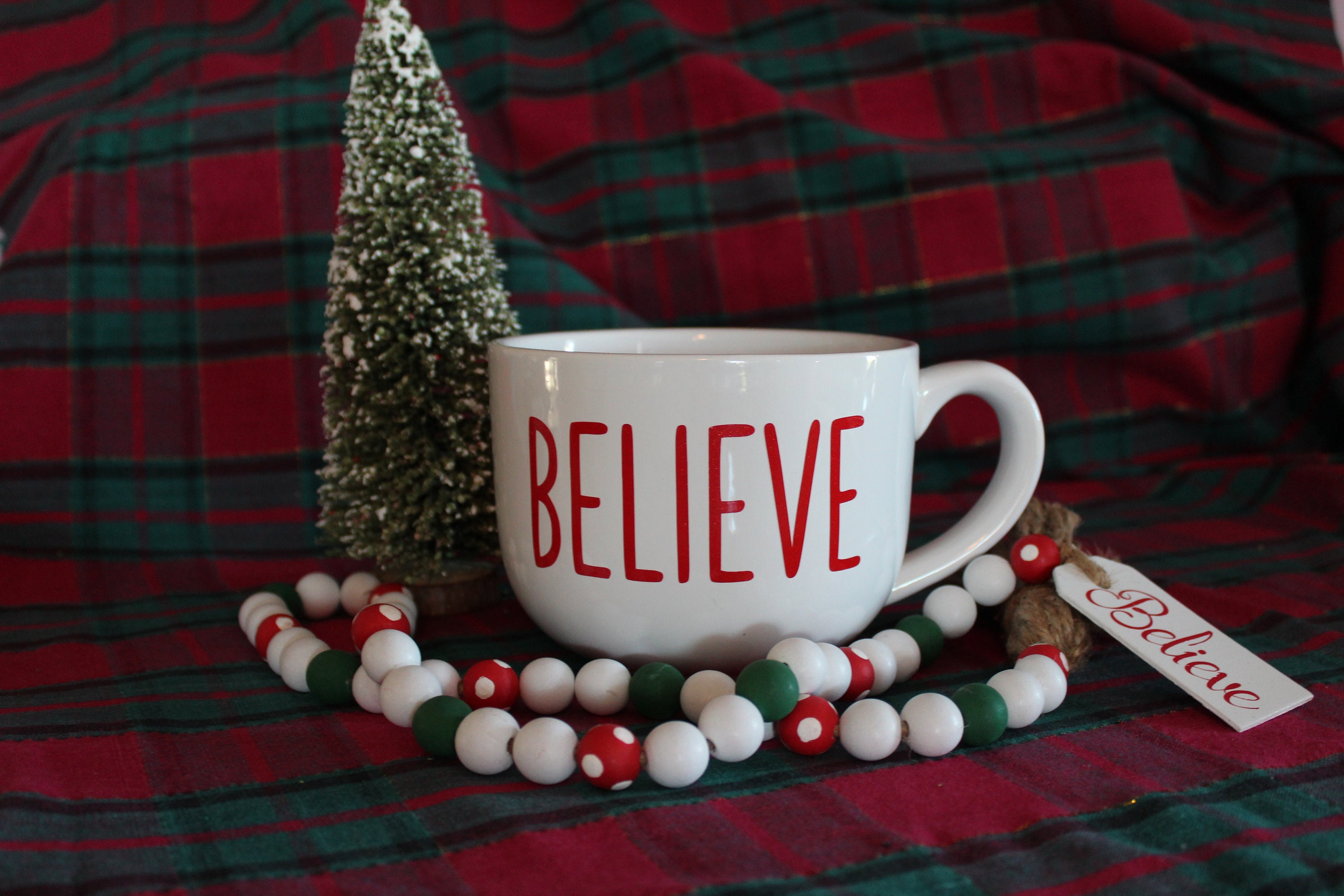 Oversized cocoa mug from GlitterMomz with believe written on it makes a great gift for the woman who's always cold