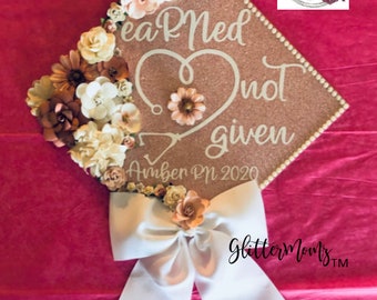 EaRNed Not Given Graduation Cap Topper Decoration- with flowers, border and bow