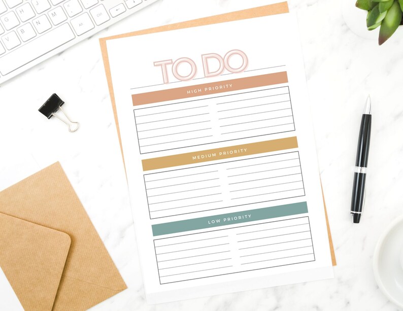 May include: A printable to-do list with three sections: high priority, medium priority, and low priority. Each section has a coloured header and lined spaces for writing tasks.