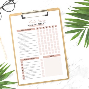 May include: A printable chore chart for kids with a pink and white color scheme. The chart includes daily and weekly chores with checkboxes for each day of the week. The chart is titled "Kids Name Chore Chart".