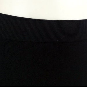 May include: Black seamless leggings with a ribbed waistband.