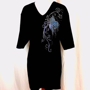 May include: Black t-shirt with a blue and silver rhinestone butterfly design on the front.