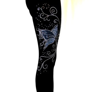 May include: Black leggings with a blue butterfly and silver rhinestone embellishments in a floral design.