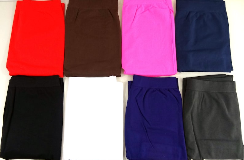 May include: Eight pairs of leggings in various colors, including black, white, red, brown, pink, navy blue, and gray.
