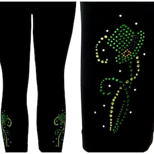 May include: Black leggings with a floral design made of green and yellow rhinestones. The leggings have a fitted silhouette and the rhinestone design is placed near the ankle. The design includes a flower and a stem.
