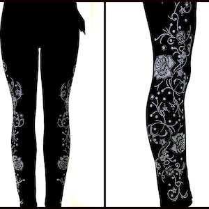 May include: Black leggings with a silver rhinestone floral design.
