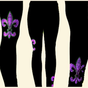 May include: Black leggings with a purple and green fleur-de-lis design on the legs.