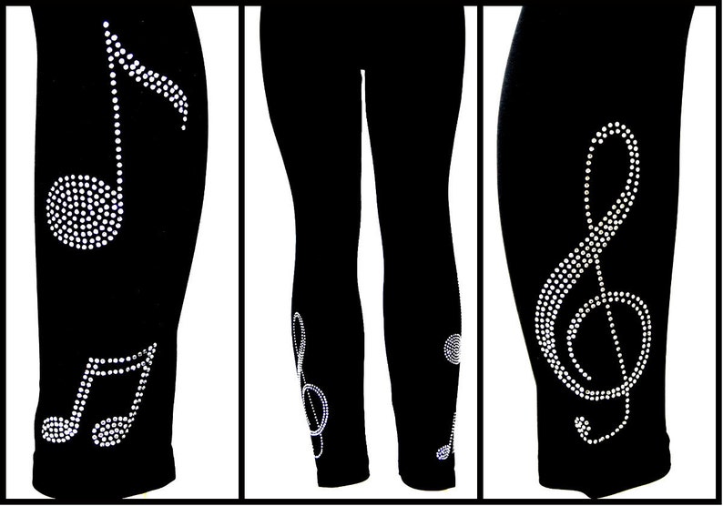 May include: Black leggings with a rhinestone treble clef design on the calf and a rhinestone musical note design on the ankle.