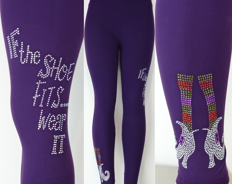 May include: Purple leggings with a rhinestone design featuring the text "If the shoe fits wear it" and a pair of witch's shoes.
