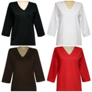 May include: Four long-sleeved shirts in different colors: black, white, brown, and red. Each shirt has a v-neck and a relaxed fit.