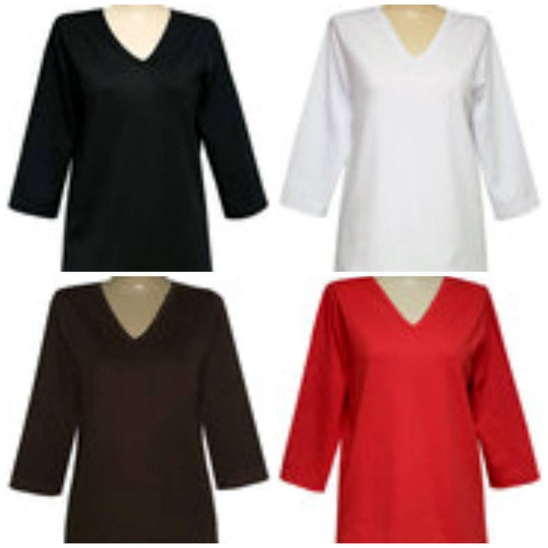 May include: Four long-sleeved shirts in different colors: black, white, brown, and red. Each shirt has a v-neck and a relaxed fit.