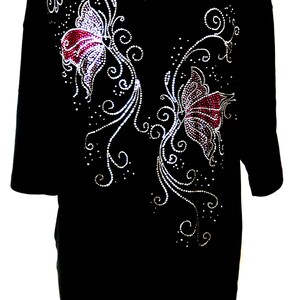May include: Black t-shirt with a rhinestone design of two butterflies and floral accents.