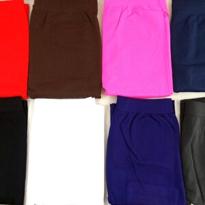 May include: Eight pairs of leggings in various colors, including black, white, red, brown, pink, navy blue, and gray.