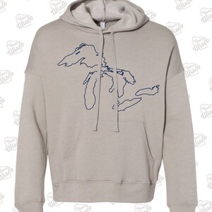 May include: A light gray hooded sweatshirt with a navy blue outline of the Great Lakes on the front.