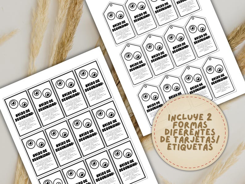 May include: Black and white printed cards and tags with cartoon eyes and the text "AVISO DE SEGURIDAD" in Spanish. The image includes a circular label with the text "INCLUYE 2 FORMAS DIFERENTES DE TARJETAS/ ETIQUETAS".