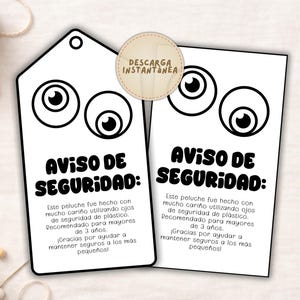 May include: Two white tags with cartoon eyes and the text "AVISO DE SEGURIDAD:" in black. The tags also include text in Spanish about the product's safety and age recommendations. A small, round sticker with the text "DESCARGA INSTANTANEA" is also present.