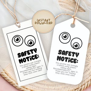 May include: Two white tags with cartoon eyes and the text "SAFETY NOTICE:" are displayed. The tags are attached with twine and include a circular "INSTANT DOWNLOAD" sticker. The text on the tags provides safety information for plushies.