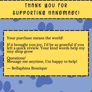 May include: A set of three ceramic mugs with a speckled, cream-colored glaze. Each mug features a different hand-painted design: a blue and green leaf, a yellow flower, and a red berry. The mugs have a simple, rounded shape.