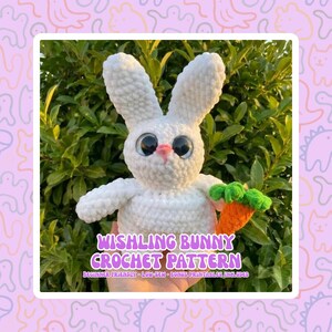 May include: A white crocheted bunny with large, expressive eyes and a pink nose, holding a small orange carrot with green leaves. The text "WISHING BUNNY CROCHET PATTERN" is displayed on the image.