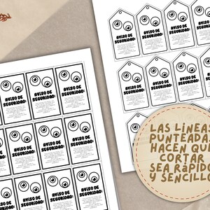 May include: Printed sheets of paper with black and white safety warning tags and rectangular cards. Each tag and card features cartoon eyes and the text "AVISO DE SEGURIDAD". A circular label reads "LAS LINEAS PUNTEADAS HACEN QUE CORTAR SEA R&Aacute;PIDO Y SENCILLO".