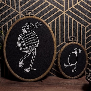 May include: A set of three ceramic mugs with a speckled, matte finish. The mugs are in shades of cream, light gray, and dark gray. Each mug has a simple, minimalist design, perfect for coffee or tea.