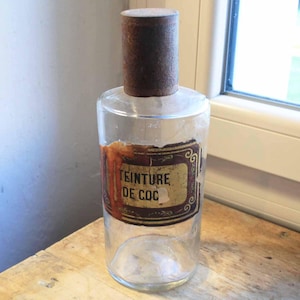 rare antique french hand blown clear glass large pharmacy bottle with hand written label. glass apothecary jar. Antique pharmacy