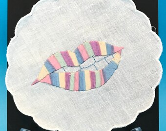 Biting Lips, Pastel Rainbow, Hand-stitched embroidered illustration wall art on vintage lace