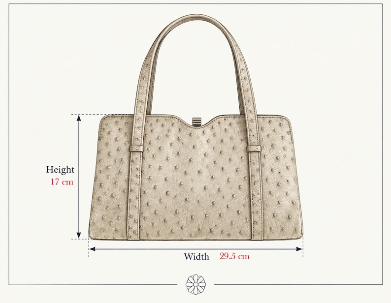 May include: A beige handbag with a textured, dotted surface pattern, two top handles, and a central clasp. The bag measures 17 cm in height and 29.5 cm in width as indicated by the text and arrows on the image, providing clear dimensions.