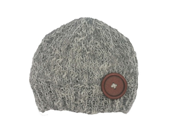 white knitted baby hat