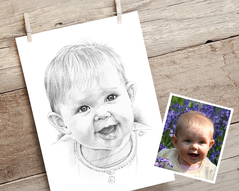 May include: A black and white pencil drawing of a baby girl with short blonde hair, smiling and looking at the camera. The drawing is on a white background.