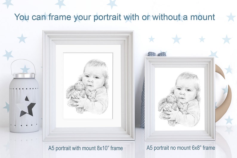 May include: Two white picture frames with a black and white drawing of a child holding a stuffed animal. The frame on the left is an 8x10 inch frame with a mat, and the frame on the right is a 6x8 inch frame without a mat. The text "You can frame your portrait with or without a mount" is at the top of the image. The text "A5 portrait with mount 8x10" frame" is below the left frame. The text "A5 portrait no mount 6x8" frame" is below the right frame.