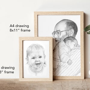 May include: Two framed pencil drawings, one of a father holding a sleeping baby and the other of a baby smiling. The larger drawing is in an 8x11 inch frame and the smaller drawing is in a 6x8 inch frame.