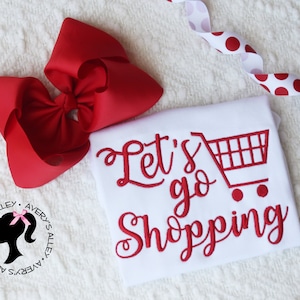 Let's Go Shopping - Girls Shopping Cart Embroidered Shirt with Add on Hair Bow