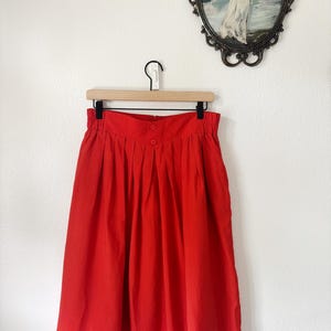 Vintage orange  midi skirt pleaded with back zipper.
